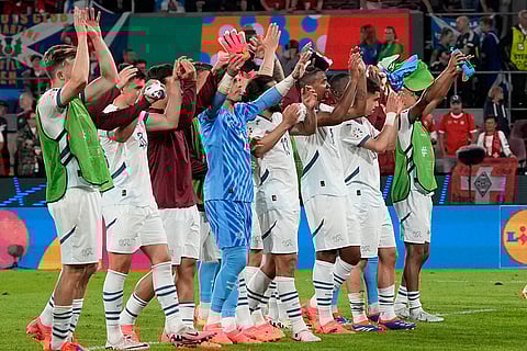 Switzerland players wave to fans after Scotland Match